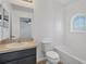 Bright bathroom featuring a window in the shower and a single vanity at 7041 Spotted Deer Pl, Riverview, FL 33569