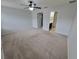 Main bedroom with ensuite bathroom access and ceiling fan at 7041 Spotted Deer Pl, Riverview, FL 33569