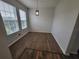 Light and airy dining room with wood-look floors at 7041 Spotted Deer Pl, Riverview, FL 33569