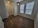 Bright dining area with wood-look floors and window at 7041 Spotted Deer Pl, Riverview, FL 33569