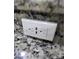 Modern electrical outlet with USB ports installed on a granite countertop at 7041 Spotted Deer Pl, Riverview, FL 33569