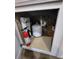 Under-sink plumbing with water filter and fire extinguisher at 7041 Spotted Deer Pl, Riverview, FL 33569