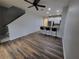 Open living area with wood-look floors at 7041 Spotted Deer Pl, Riverview, FL 33569