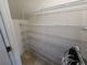 Interior view of walk-in pantry with multiple rows of adjustable wire shelving for optimal storage at 7041 Spotted Deer Pl, Riverview, FL 33569