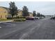 Community parking lot with townhouses at 7041 Spotted Deer Pl, Riverview, FL 33569