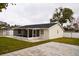 Screened patio with paver stones and spacious grassy yard at 7097 Aberfeldy N Ave, St Petersburg, FL 33709