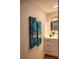 Clean bathroom with updated vanity and stylish art at 7097 Aberfeldy N Ave, St Petersburg, FL 33709