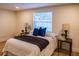 Bedroom with a queen bed, blue pillows, and a window with blinds at 7097 Aberfeldy N Ave, St Petersburg, FL 33709