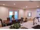 Bright dining area with wooden table and french doors leading to the backyard at 7097 Aberfeldy N Ave, St Petersburg, FL 33709