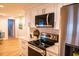 Updated kitchen featuring stainless steel appliances and white cabinetry at 7097 Aberfeldy N Ave, St Petersburg, FL 33709