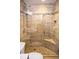 Large tiled shower with glass enclosure and built-in seat at 7097 Aberfeldy N Ave, St Petersburg, FL 33709