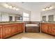 Bathroom with granite double vanity and soaking tub at 7119 Peregrina Loop, Wesley Chapel, FL 33545