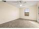 Well-lit bedroom featuring neutral walls and carpet at 7119 Peregrina Loop, Wesley Chapel, FL 33545