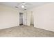 Bright bedroom with ceiling fan and carpet flooring at 7119 Peregrina Loop, Wesley Chapel, FL 33545