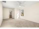 Bedroom with ceiling fan and access to a bathroom at 7119 Peregrina Loop, Wesley Chapel, FL 33545