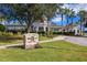 The Watergrass Club exterior; inviting clubhouse with landscaping at 7119 Peregrina Loop, Wesley Chapel, FL 33545