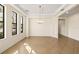 Empty dining room with tile floors and chandelier at 7119 Peregrina Loop, Wesley Chapel, FL 33545