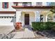 Front entrance with a double door and a small porch at 7119 Peregrina Loop, Wesley Chapel, FL 33545