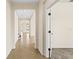 Bright hallway with tile floors and archways at 7119 Peregrina Loop, Wesley Chapel, FL 33545