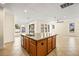 Spacious kitchen island with granite countertop and sink at 7119 Peregrina Loop, Wesley Chapel, FL 33545