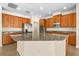 Modern kitchen with granite countertops and wood cabinets at 7119 Peregrina Loop, Wesley Chapel, FL 33545