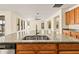 Kitchen island boasts a large double sink with modern faucet at 7119 Peregrina Loop, Wesley Chapel, FL 33545