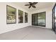 Screened patio with ceiling fan and sliding door access at 7119 Peregrina Loop, Wesley Chapel, FL 33545