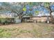 Large backyard with mature trees and outbuildings at 7401 Mount Vernon Rd, Tampa, FL 33625