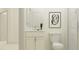 Clean bathroom with white vanity, toilet, and a walk-in shower at 7512 E 116Th St, Palmetto, FL 34221