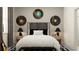 Modern bedroom with a gray headboard and vinyl record decor at 7512 E 116Th St, Palmetto, FL 34221