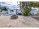 Spacious backyard with fire pit and pool at 7601 9Th N Ave, St Petersburg, FL 33710