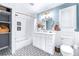 Bathroom with tub, shower, and geometric tile floor at 7601 9Th N Ave, St Petersburg, FL 33710