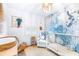 Bedroom with crib, ocean-themed wall mural, and plenty of storage at 7601 9Th N Ave, St Petersburg, FL 33710