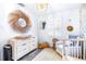 Bedroom with dresser, wicker basket and ocean-themed decor at 7601 9Th N Ave, St Petersburg, FL 33710