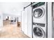 Modern laundry room with stackable washer and dryer, and barn door at 7601 9Th N Ave, St Petersburg, FL 33710