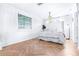 Bright and airy main bedroom, featuring herringbone floors and a chandelier at 7601 9Th N Ave, St Petersburg, FL 33710