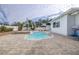 Relaxing kidney-shaped pool with patio at 7601 9Th N Ave, St Petersburg, FL 33710