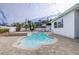 Modern kidney-shaped pool and patio at 7601 9Th N Ave, St Petersburg, FL 33710