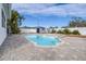 Refreshing kidney-shaped pool with surrounding patio at 7601 9Th N Ave, St Petersburg, FL 33710