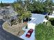 Aerial view of this home showing its beautiful landscaping, new roof, and ample parking space in a great neighborhood at 7923 Leighton Cir, New Port Richey, FL 34654