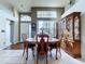 A lovely formal dining area with natural light and high ceilings for a sense of grandeur at 7923 Leighton Cir, New Port Richey, FL 34654