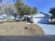 Charming one-story home featuring an attached two-car garage and a well-manicured front yard at 7923 Leighton Cir, New Port Richey, FL 34654