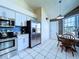 Cozy kitchen nook with a dining table, stainless steel appliances, and natural light at 7923 Leighton Cir, New Port Richey, FL 34654