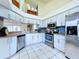 Bright kitchen with stainless steel appliances, white cabinets, and modern finishes at 7923 Leighton Cir, New Port Richey, FL 34654