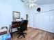 Bright office with wood floors, ceiling fan, desk, closet, and window at 7923 Leighton Cir, New Port Richey, FL 34654