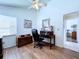 Bright office with wood floors, ceiling fan, desk and window at 7923 Leighton Cir, New Port Richey, FL 34654