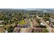 Aerial view of townhouses near the water with a community pool at 820 Date Palm Ln, St Petersburg, FL 33707