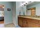 Double vanity bathroom with granite countertop and a shower at 820 Date Palm Ln, St Petersburg, FL 33707