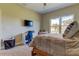 Bedroom with a double bed, window, and built-in workspace at 820 Date Palm Ln, St Petersburg, FL 33707