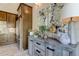 Stylish kitchen island with wood cabinets and granite countertop at 820 Date Palm Ln, St Petersburg, FL 33707